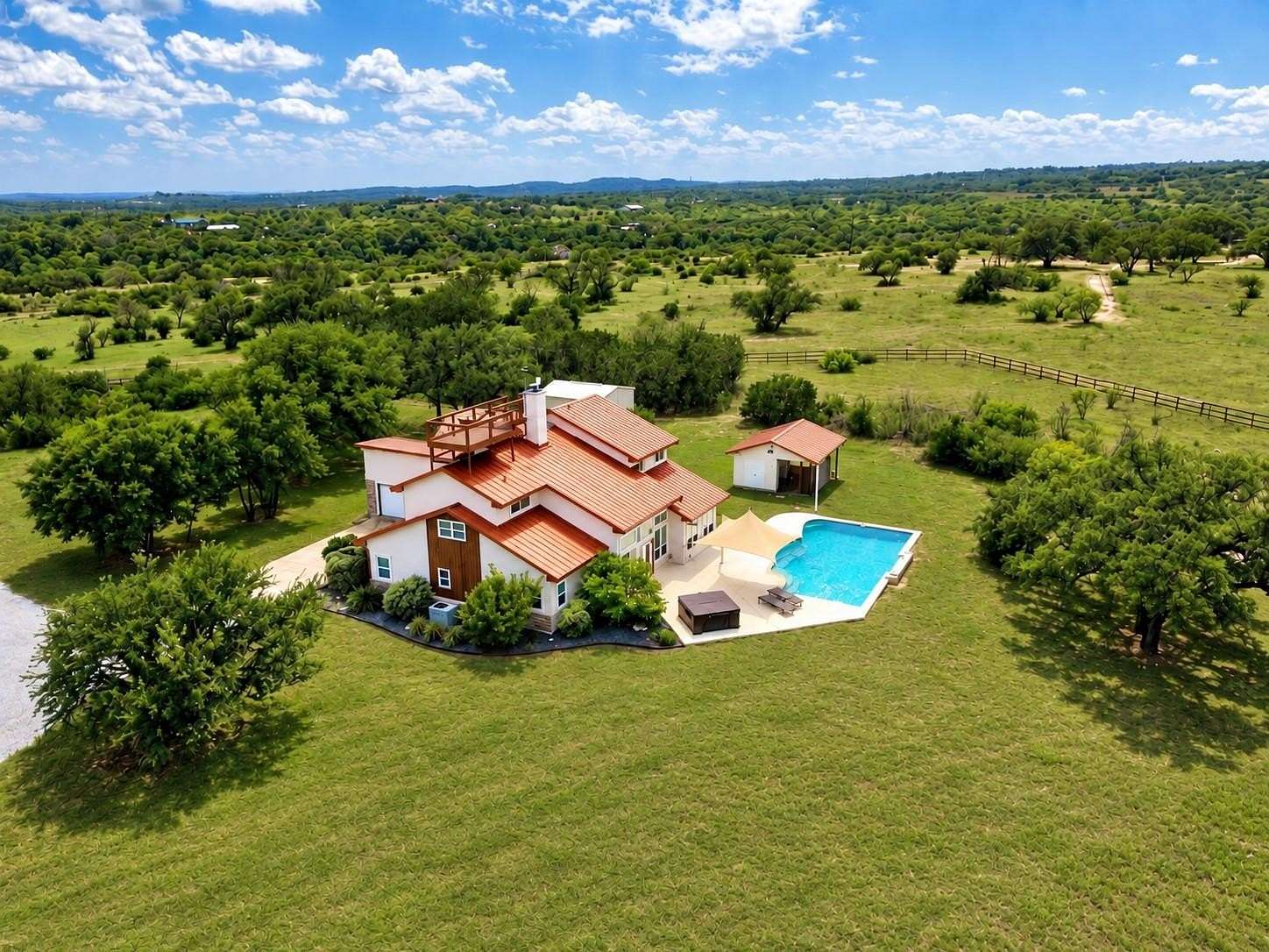 10.9 Acres of Land with Home for Sale in Spicewood, Texas