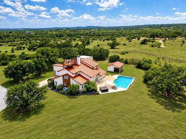 10.9 Acres of Land with Home for Sale in Spicewood, Texas