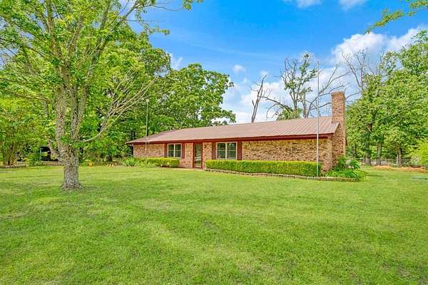 7.68 Acres of Land with Home for Sale in Powderly, Texas