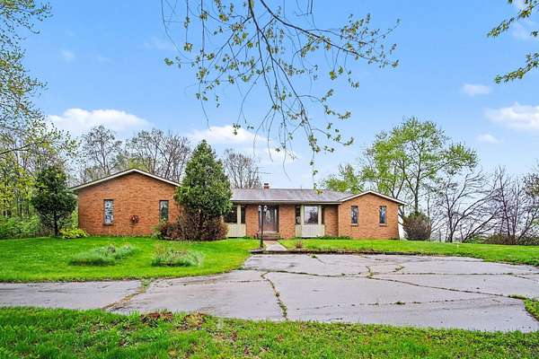 9.4 Acres of Land with Home for Sale in Coopersville, Michigan