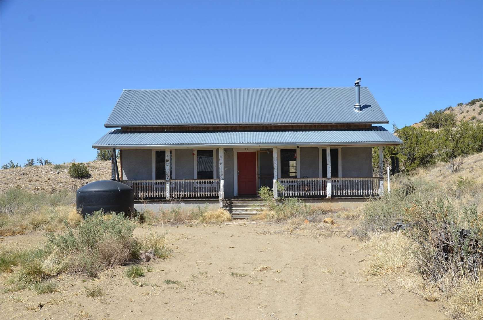 20 Acres of Recreational Land with Home for Sale in Madrid, New Mexico