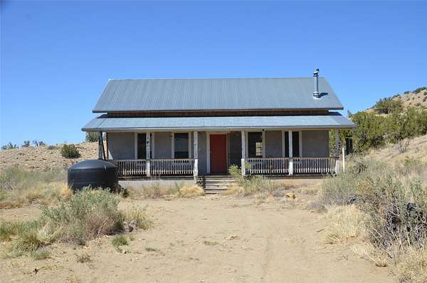 20 Acres of Recreational Land with Home for Sale in Madrid, New Mexico