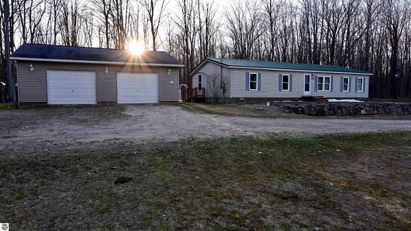 9.88 Acres of Land with Home for Sale in Mancelona, Michigan
