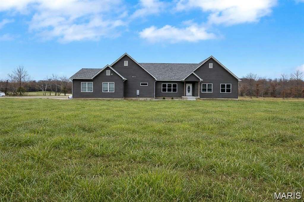 33.8 Acres of Agricultural Land with Home for Sale in De Soto, Missouri