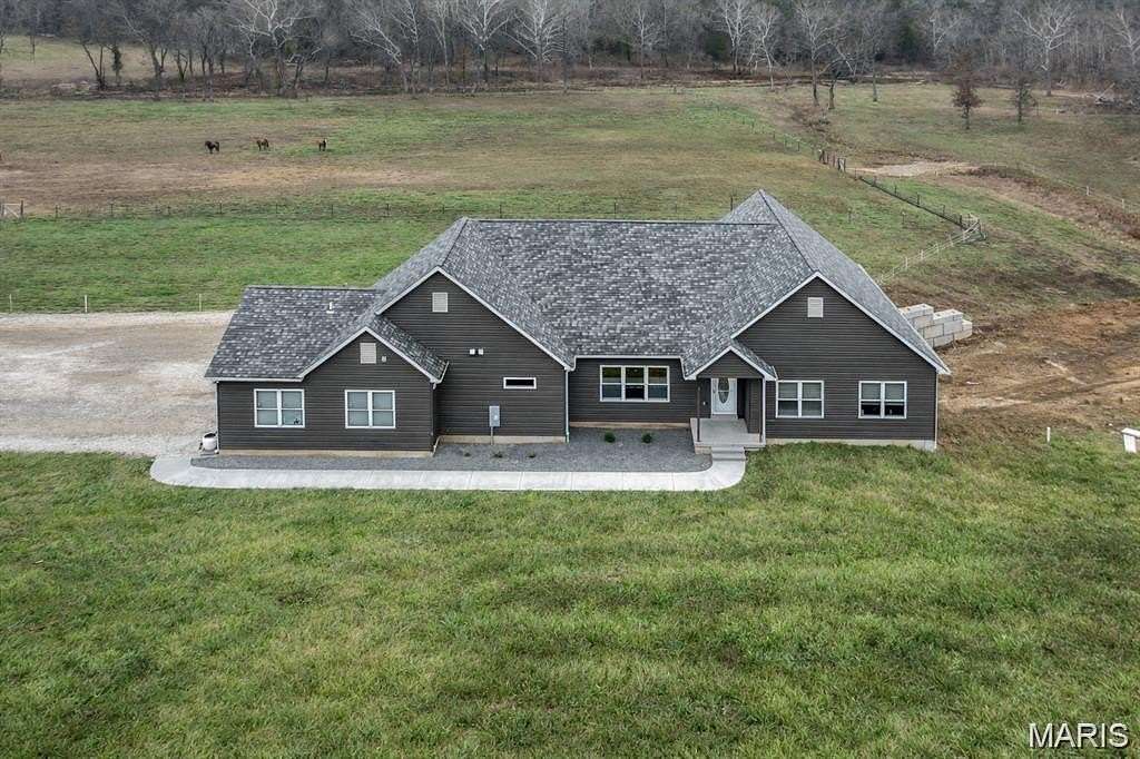 33.8 Acres of Agricultural Land with Home for Sale in De Soto, Missouri