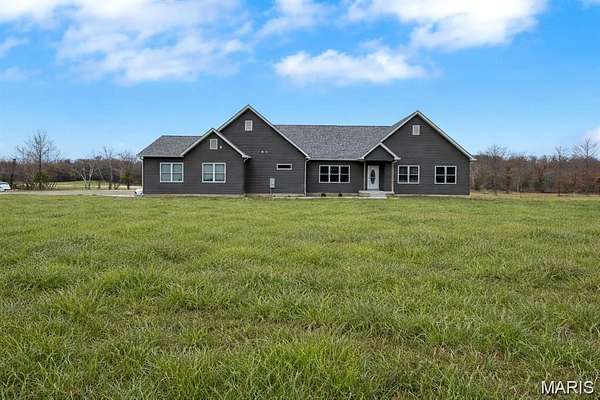 33.8 Acres of Agricultural Land with Home for Sale in De Soto, Missouri