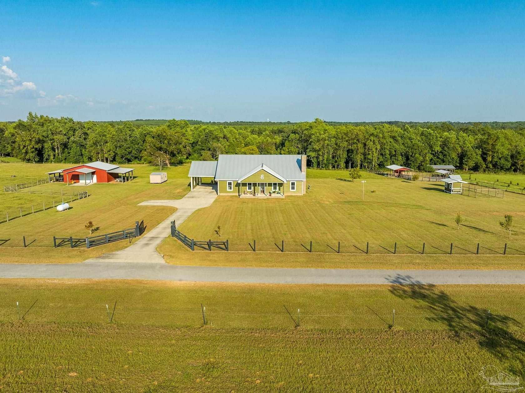 20.4 Acres of Agricultural Land with Home for Sale in Molino, Florida