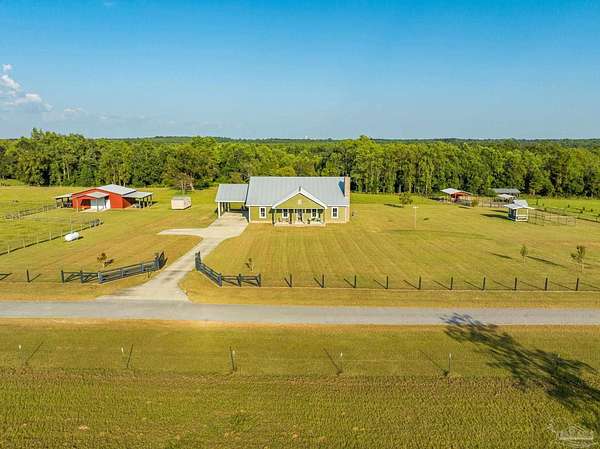 20.4 Acres of Agricultural Land with Home for Sale in Molino, Florida