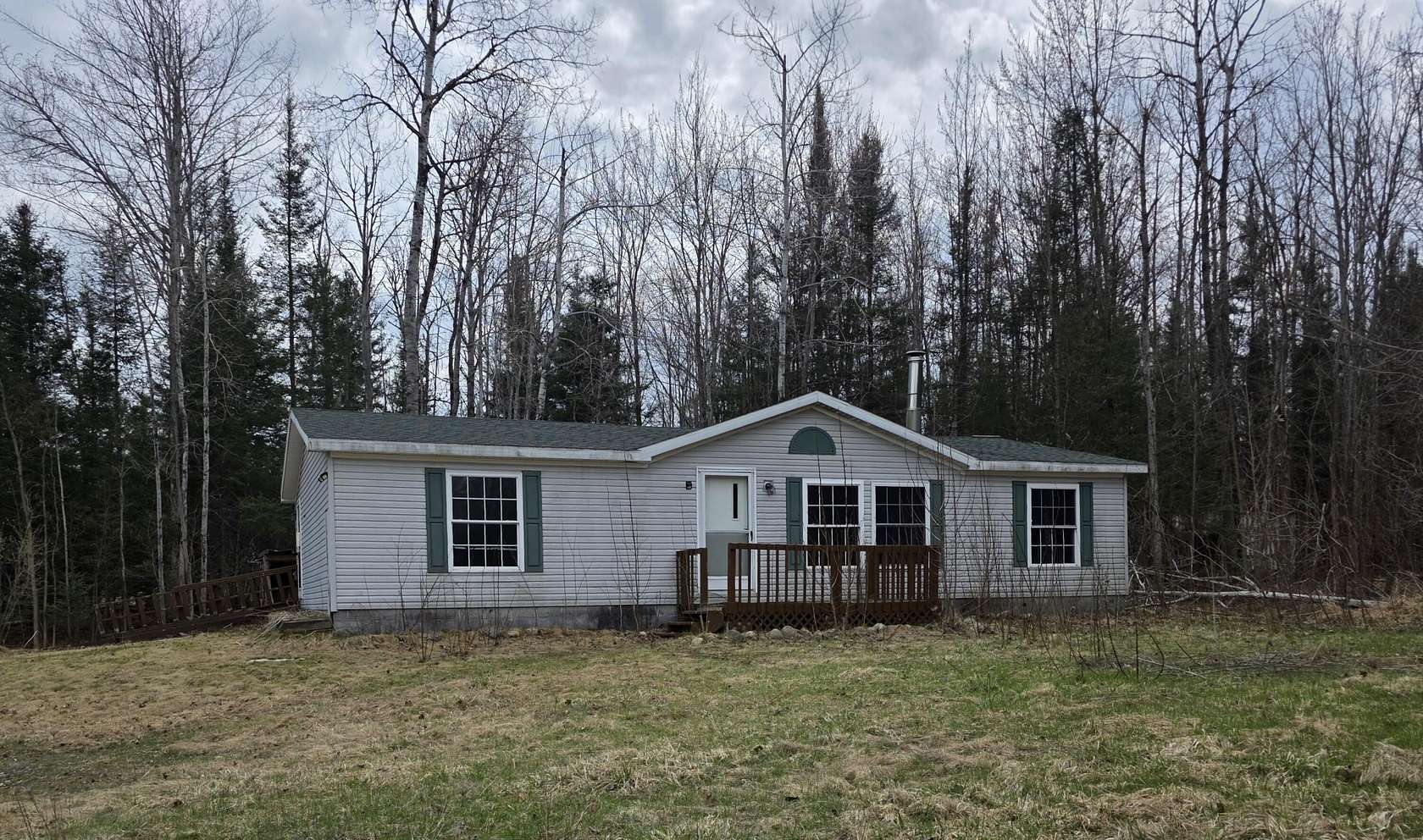 8.7 Acres of Land with Home for Auction in Hillman, Michigan