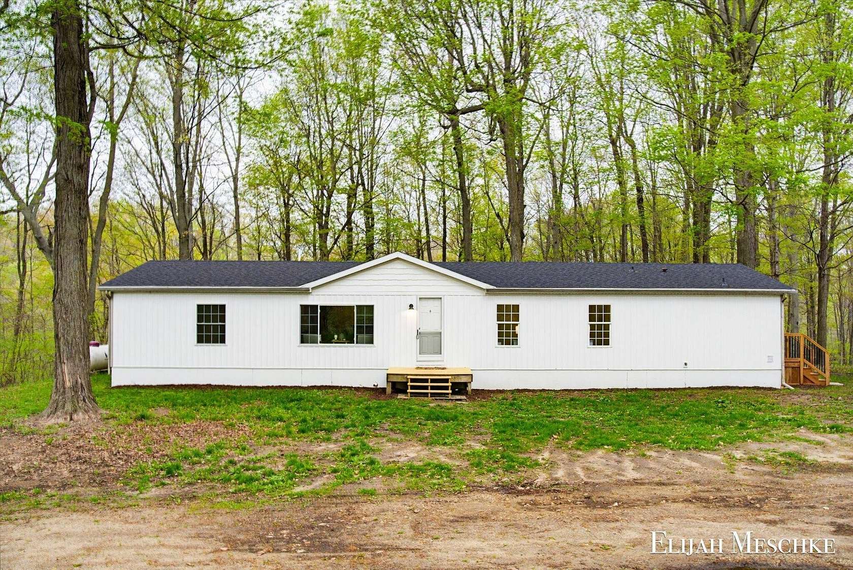 3 Acres of Land with Home for Sale in Delton, Michigan