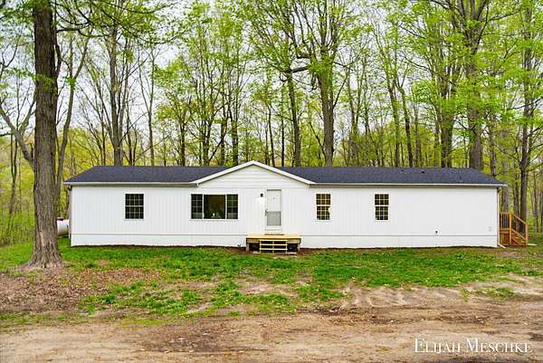 3 Acres of Land with Home for Sale in Delton, Michigan