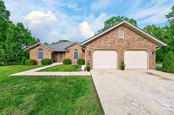 9.59 Acres of Land with Home for Sale in Grovespring, Missouri