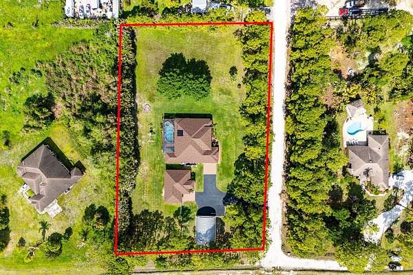 2.5 Acres of Land with Home for Sale in The Acreage, Florida