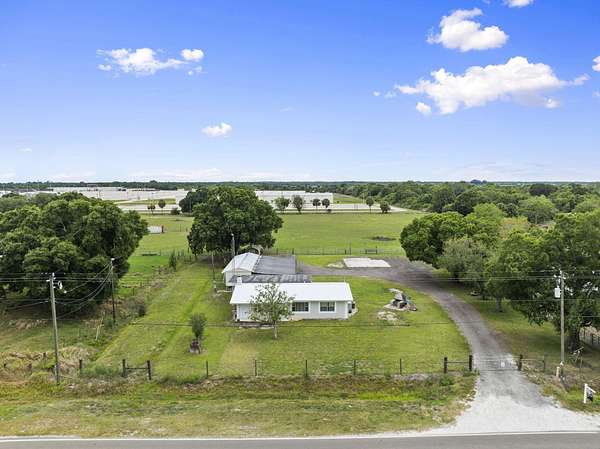 7.4 Acres of Land with Home for Sale in Okeechobee, Florida