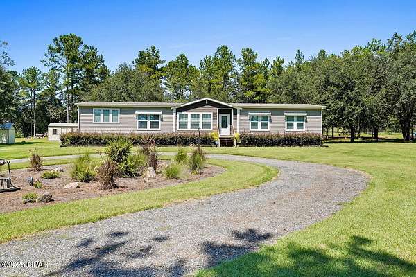 4 Acres of Land with Home for Sale in Sneads, Florida