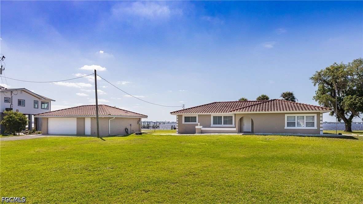 1.53 Acres of Land with Home for Sale in North Fort Myers, Florida