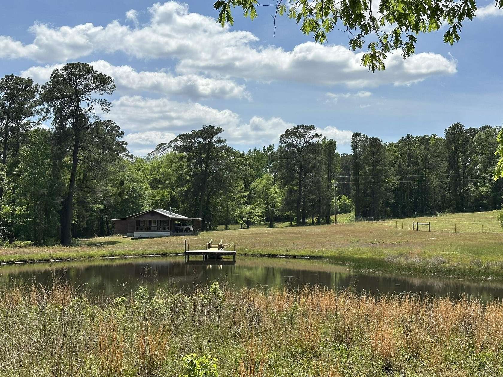 203 Acres of Land with Home for Sale in Wing, Alabama