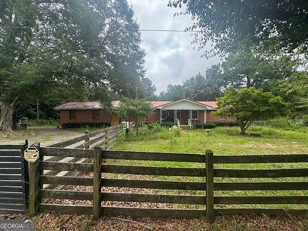 13.6 Acres of Land with Home for Sale in Reynolds, Georgia