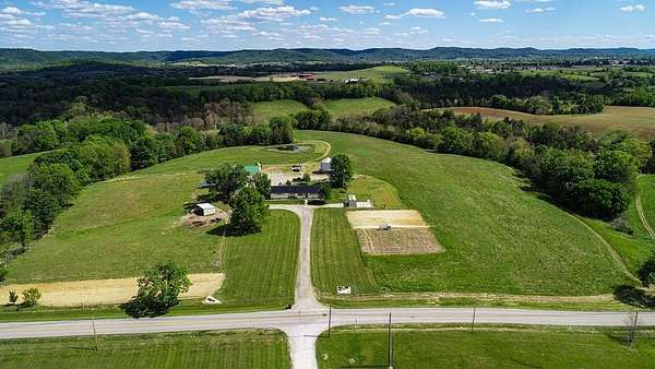 76 Acres of Land with Home for Sale in Tollesboro, Kentucky