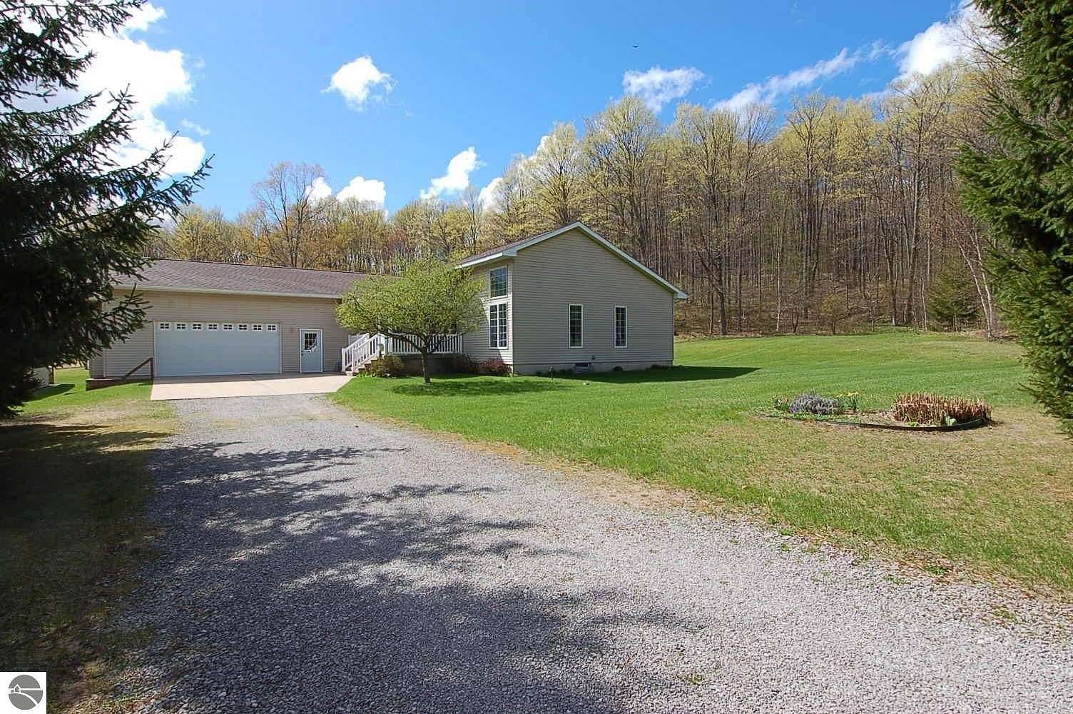 10 Acres of Recreational Land with Home for Sale in Harrietta, Michigan