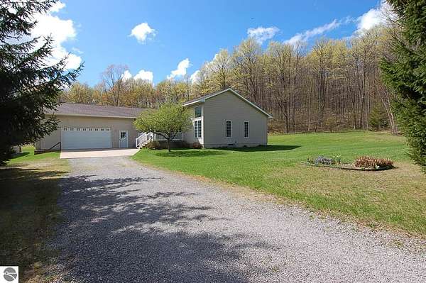 10 Acres of Recreational Land with Home for Sale in Harrietta, Michigan