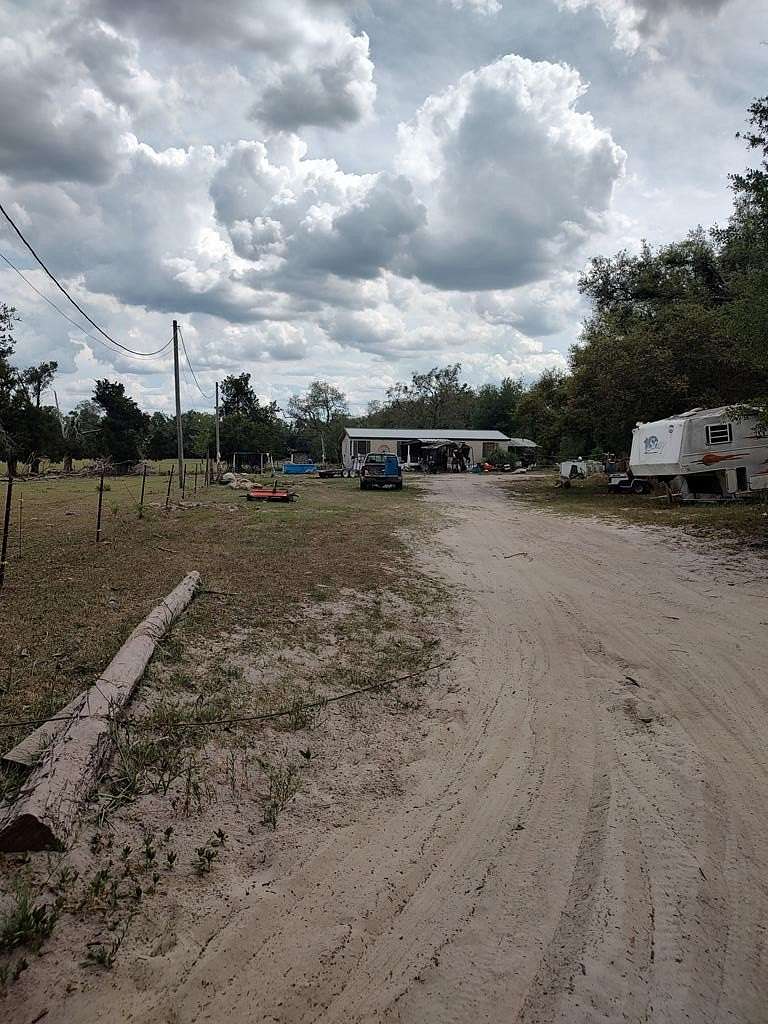 2.56 Acres of Land with Home for Sale in McAlpin, Florida