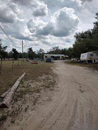 2.56 Acres of Land with Home for Sale in McAlpin, Florida