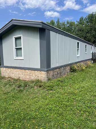 4 Acres of Land with Home for Sale in Pittsfield, Maine