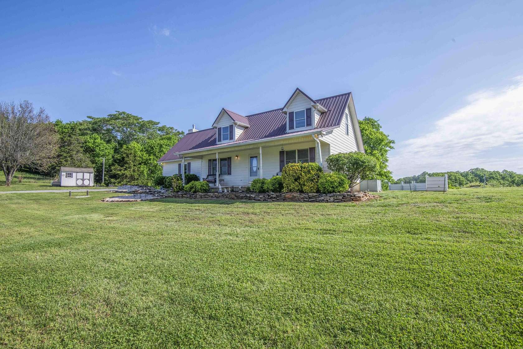 5.5 Acres of Land with Home for Sale in Friendsville, Tennessee