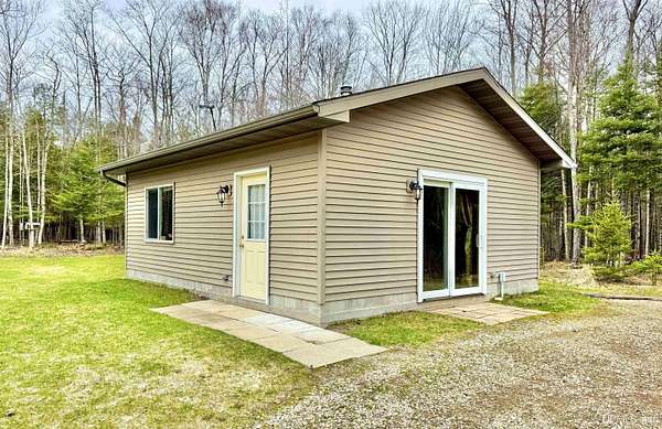 20 Acres of Recreational Land with Home for Sale in Rapid River, Michigan