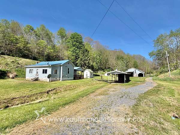 6.6 Acres of Land with Home for Auction in West Union, West Virginia
