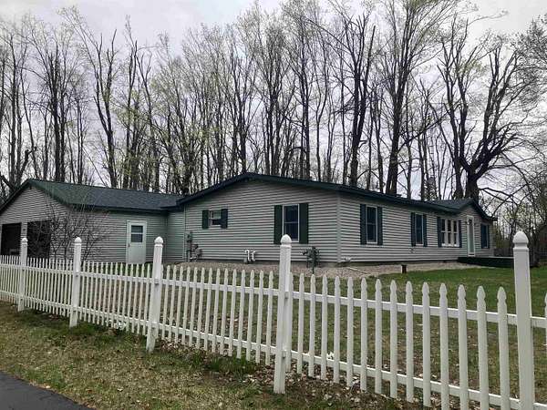 1.5 Acres of Land with Home for Sale in Vanderbilt, Michigan