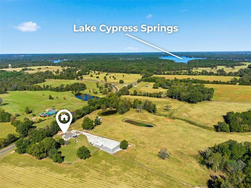 92.4 Acres of Land with Home for Sale in Scroggins, Texas