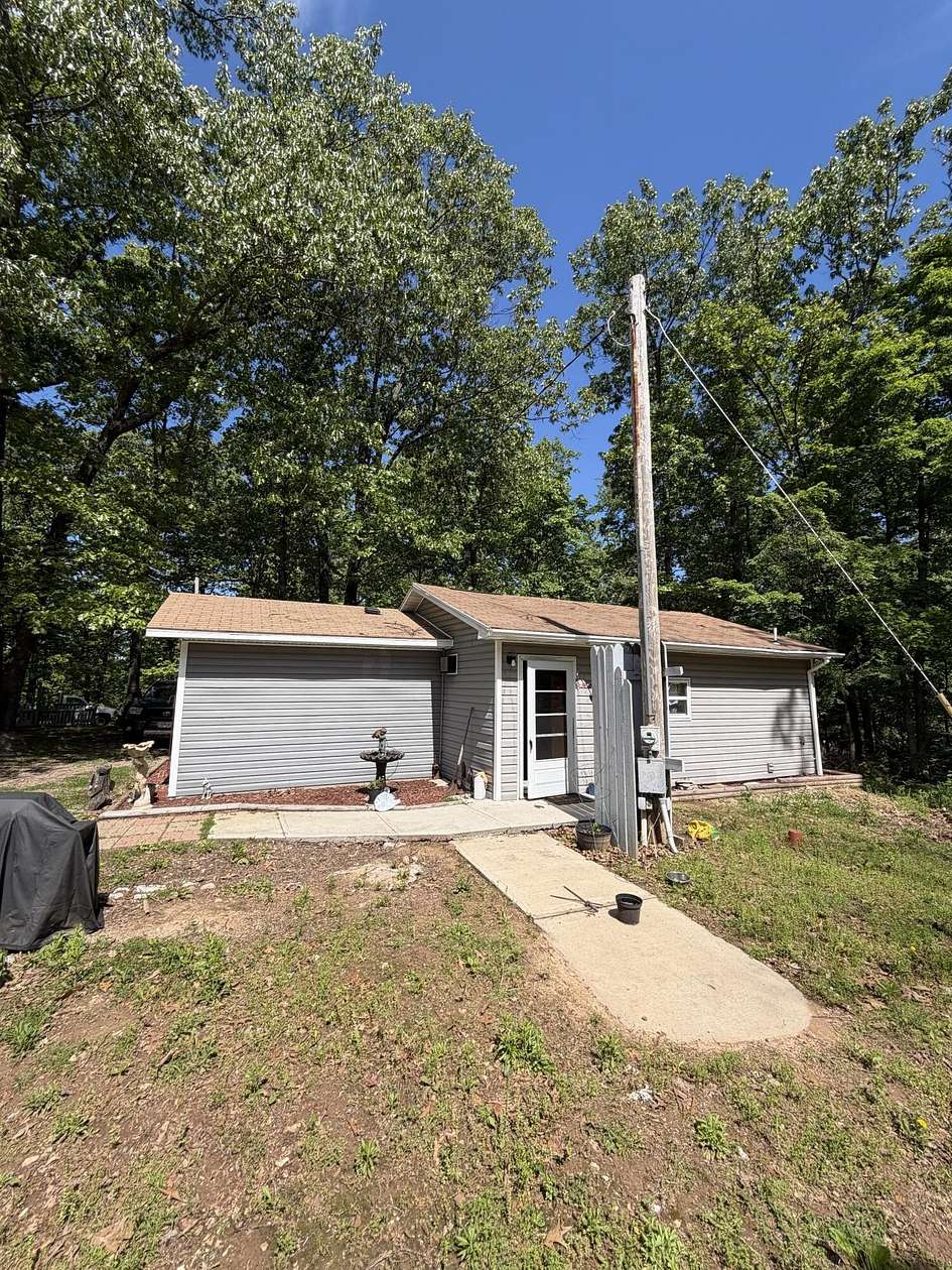 7 Acres of Land with Home for Sale in Reeds Spring, Missouri