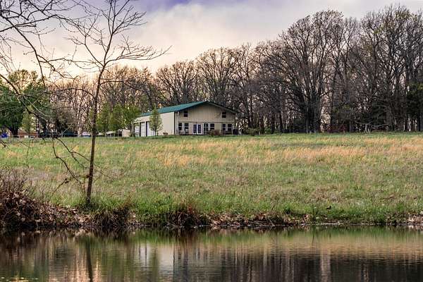 50 Acres of Land with Home for Sale in Humansville, Missouri
