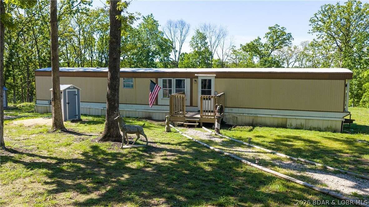 10.5 Acres of Recreational Land with Home for Sale in Barnett, Missouri
