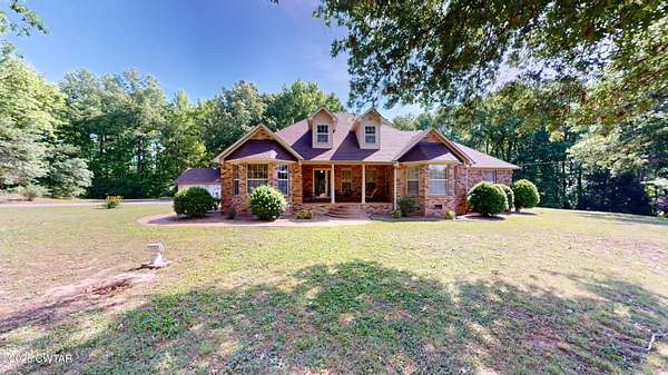 23.2 Acres of Land with Home for Sale in Halls, Tennessee