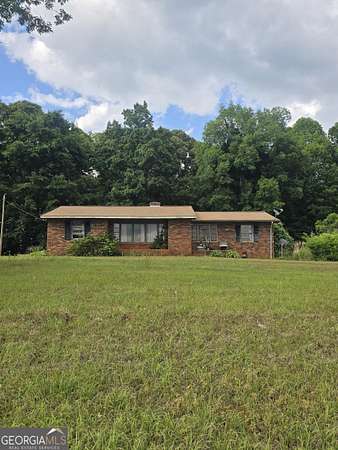 16.1 Acres of Land with Home for Sale in Carnesville, Georgia