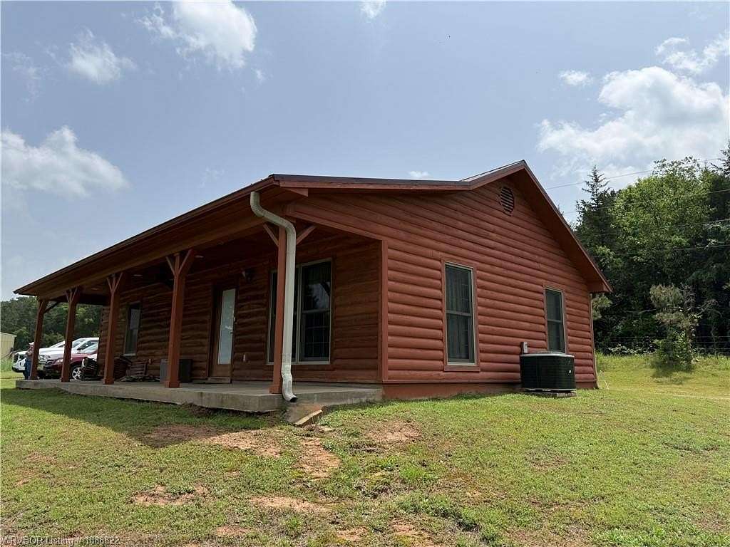 9.36 Acres of Land with Home for Auction in Paris, Arkansas