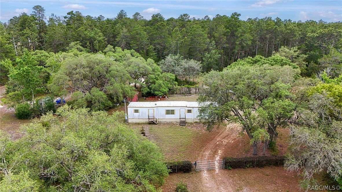 2.64 Acres of Land with Home for Sale in Dunnellon, Florida