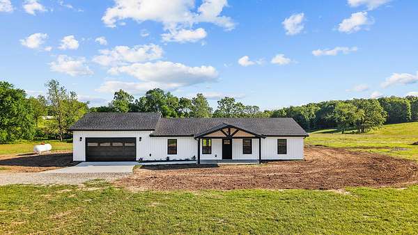 7.5 Acres of Land with Home for Sale in Crane, Missouri