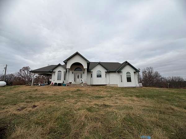 97.7 Acres of Agricultural Land with Home for Sale in Novinger, Missouri