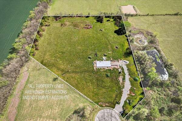 5.44 Acres of Land with Home for Sale in Carthage, Missouri