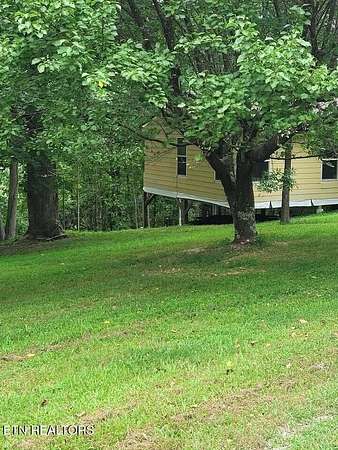 5.34 Acres of Land with Home for Auction in Hilham, Tennessee