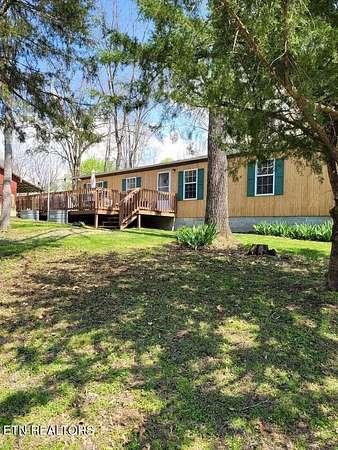 13.7 Acres of Land with Home for Auction in Hilham, Tennessee
