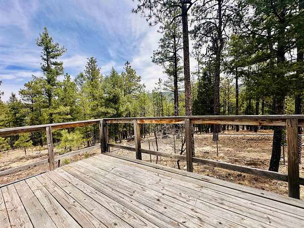 7.8 Acres of Land with Home for Sale in Guadalupita, New Mexico