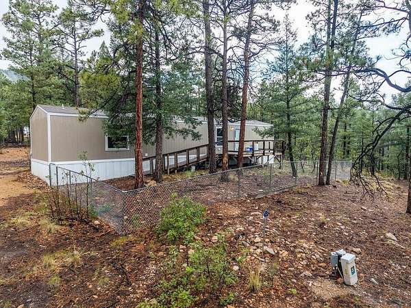 7.8 Acres of Land with Home for Sale in Guadalupita, New Mexico