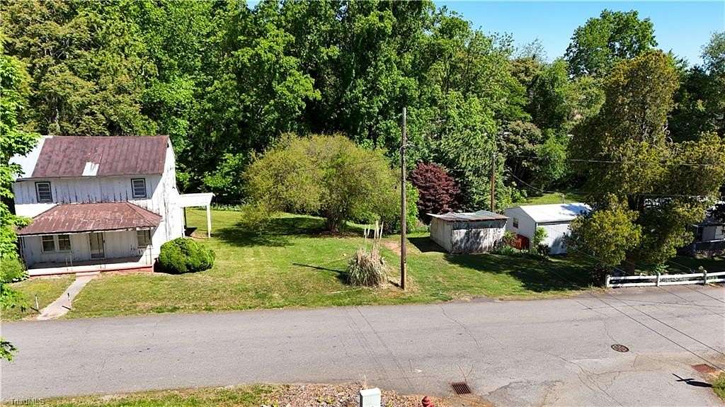 0.66 Acres of Land with Home for Auction in Dobson, North Carolina