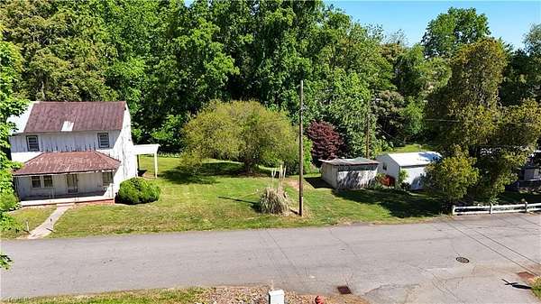 0.66 Acres of Land with Home for Auction in Dobson, North Carolina