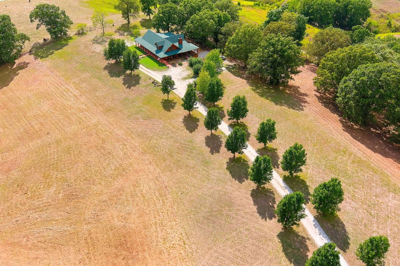 7 Acres of Land with Home for Sale in Reeds Spring, Missouri